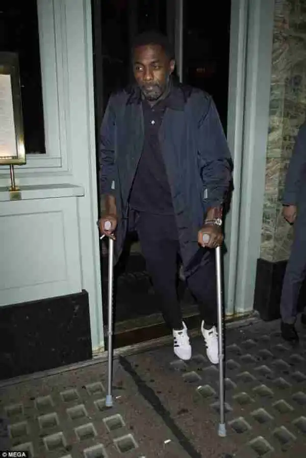 Actor Idris Elba Leaves A London Restaurant On Crutches After Breaking His Leg (Photos)